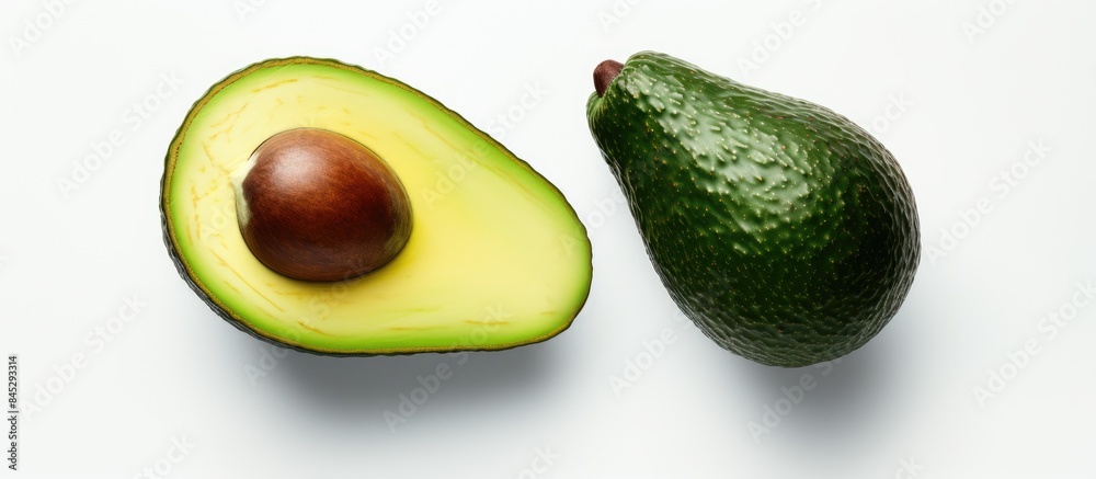 Poster an avocado sliced in half rests on a white backdrop the image offers copy space and serves as a bann