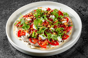 Vibrant image of a gourmet roti with assorted toppings, served on a white plate against a dark background. Perfect for Italian cuisine concepts