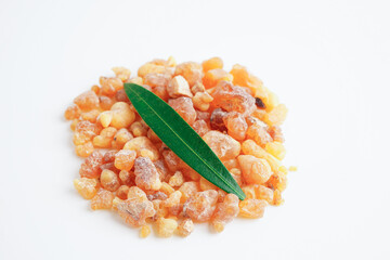 Frankincense or olibanum aromatic resin isolated on white background used in incense and perfumes.