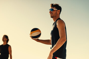 Professional beach volleyball players compete in sunny coastal championship