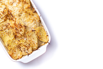 Potato gratin baked with cream and cheese isolated on white background. Top view. Copy space