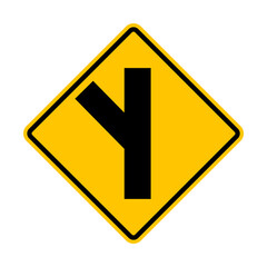 Unregulated intersection with an adjacent road. From left side. Sign for merging road on left side. Road junction. A junction where one street or road intersects another. Warning yellow sign.