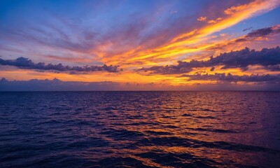 Fototapeta premium Sea with golden clouds during sunset