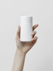 A woman's hand holds a single cosmetic product.
