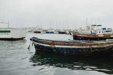 Fototapeta premium Traditional fishing boats in a small harbour on Procida Island, Italy