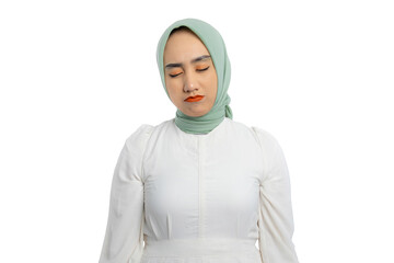 Beautiful young Asian woman in green hijab and white blouse crying with sad and depressed expression isolated on white background