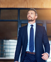 Professional, vision and walking with lawyer man leaving office of legal firm for court or trial. Justice, suit and thinking with confident, mature attorney or legal consultant at work for law © Cecilie S/peopleimages.com