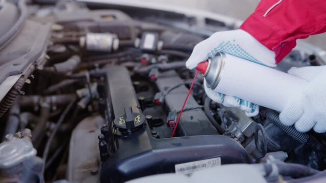 Increased oil consumption due to clogged oil channels. Car engine maintenance, cleaning inside engine from carbon and grime. decarbonization diesel and petrol engines with cleaning spray foam.