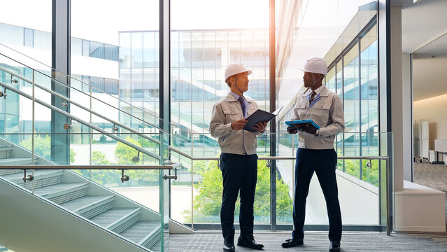 Group of multinational engineers having a conversation in a building