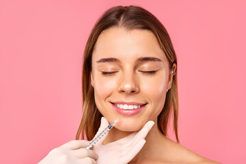 A woman is receiving a facial treatment at a salon to achieve a glowing and youthful look