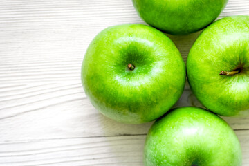 Healthy green food with apples on kitchen white background