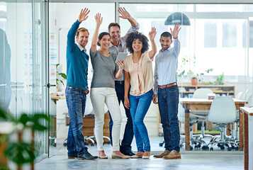 Portrait, team and business people waving hands for welcome, success or greeting in creative startup. Happy, group and wave together for hello, introduction or about us in meeting for collaboration