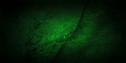 A deep green textured rock surface with subtle shading, creating a moody and natural background. Perfect for design projects that require an earthy and rugged aesthetic with rich color tones