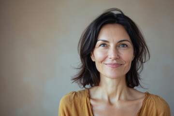 Fototapeta premium A close up portrait of a woman with a subtle smile