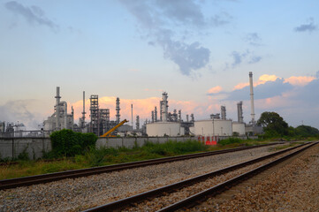 Fototapeta premium Oil refinery industry and Petrochemical and natural gas and oil storage tanks, blue background