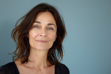 Fototapeta premium A close up portrait of a woman with a subtle smile