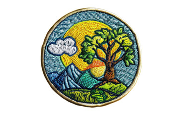 Detailed embroidered patch of a colorful nature scene with a tree, mountains, and a vibrant sunset, perfect for outdoor enthusiasts.