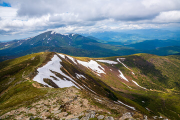 Spectacular view of mountains covered with snow in summer