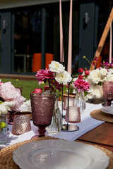 Table decor, garden event. Inspiration in luxury picnic and outdoor celebrations. Romantic dining summer garden picnic.