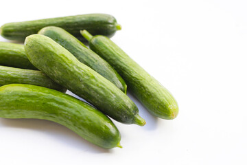 Mini cucumbers on white background.