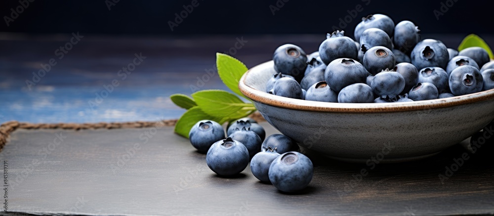 Wall mural closeup view of blueberries in a plate on the table. creative banner. copyspace image - Wall murals