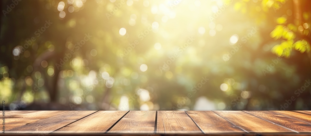 Poster empty top of wooden table with abstract of bokeh and natural light of the summer season vintage styl