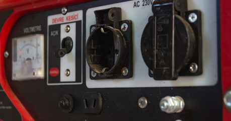 Close-up of sockets on a gasoline generator