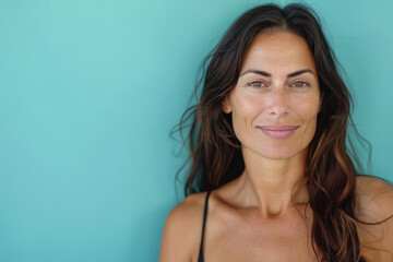 A close up portrait of a woman with a subtle smile