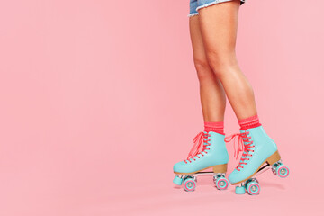 Close up cropped side view photo shot of young woman she wearing modern blue rollers rollerblading...