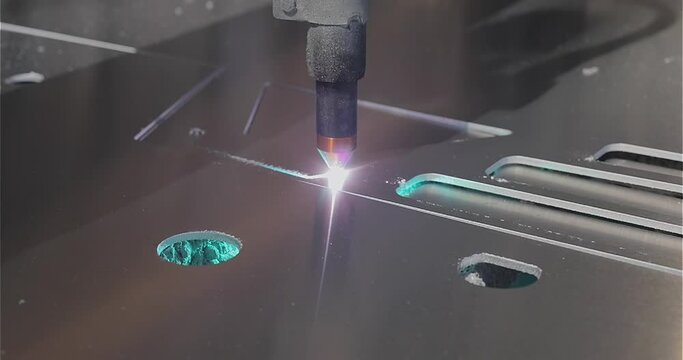The work of a plasma cutter close-up. A plasma cutter cuts a detail, close-up. The work of the CNC plasma cutter