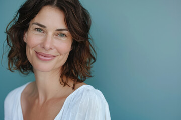 Fototapeta premium A close up portrait of a woman with a subtle smile