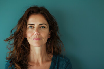 A close up portrait of a woman with a subtle smile