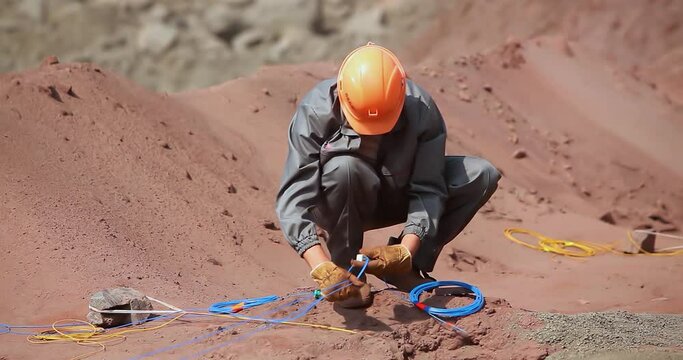 Workers are preparing a quarry for the explosion. Development of an iron ore quarry.