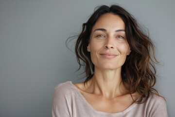 Fototapeta premium A close up portrait of a woman with a subtle smile