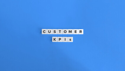 Customer KPIs (Key Performance Indicators). Customer Satisfaction (CSAT), Net Promoter Score (NPS), Customer Retention Rate, Customer Lifetime Value (CLV). Text on Block Letter Tiles.
