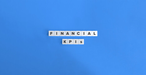 Financial KPIs (Key Performance Indicators). Revenue Growth Rate, Net Profit Margin, Return on Investment (ROI), Economic Value Added (EVA). Text on Block Letter Tiles.
