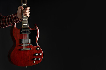 A man plays a beautiful guitar close-up