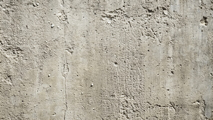 Rough gray concrete wall with weathered paint texture