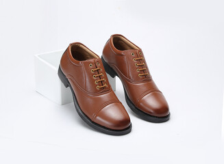 tan leather formal uniform shoes isolated on white background