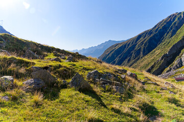 Naklejka premium Scenic view at Swiss mountain pass Gotthard with alpine landscape on a sunny late summer day. Photo taken September 10th, 2023, Gotthard, Canton Ticino, Switzerland.