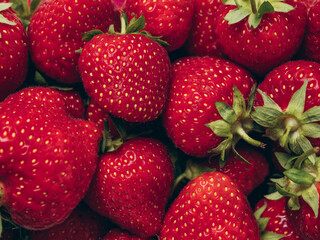Fresh red ripe strawberries background. Closeup, top view.