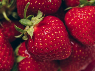 Fresh red ripe strawberries background. Closeup, top view.