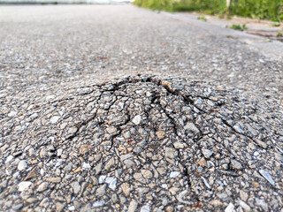 asphalt in the approximation with a protruding hole