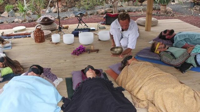 Outdoor sound therapy session with a group of relaxed participants