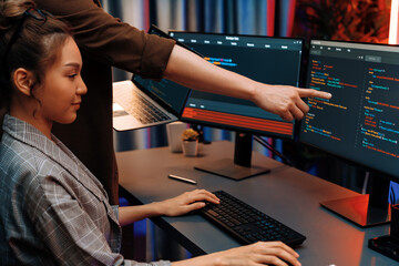 Serious of IT developers discussing intelligent website development coder system running data...