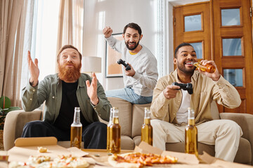 Three handsome, cheerful men of different races sit around a table, enjoying pizza and each others company in a casual setting.