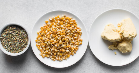Overhead view of corn millet and nigerian akamu or pap, process of making akamu, flatlay of process of making nigerian akamu ogi pap or corn pudding