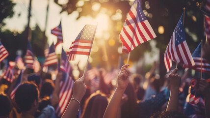 people waving American flags in celebration on the street