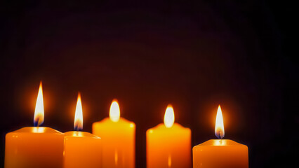 Christmas candles with a christmas decoration on it. A bunch of candles that are on a table. Bunch of red candles burning on wooden table with traditional christmas pine decoration on wood textured