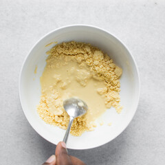 Overhead view of nigerian akamu or pap paste, process of making akamu, flatlay of process of making nigerian akamu ogi pap or corn pudding
